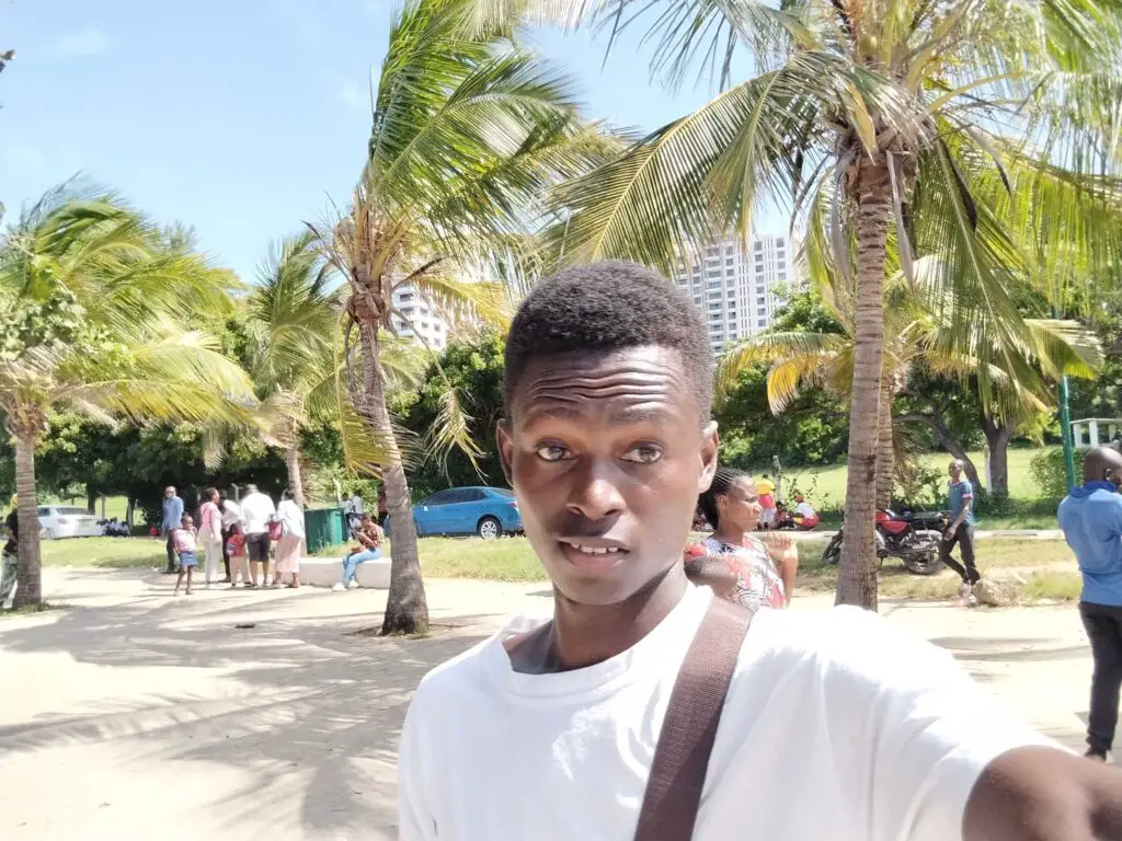A man taking a selfie at Mama Ngina waterfront in Mombasa