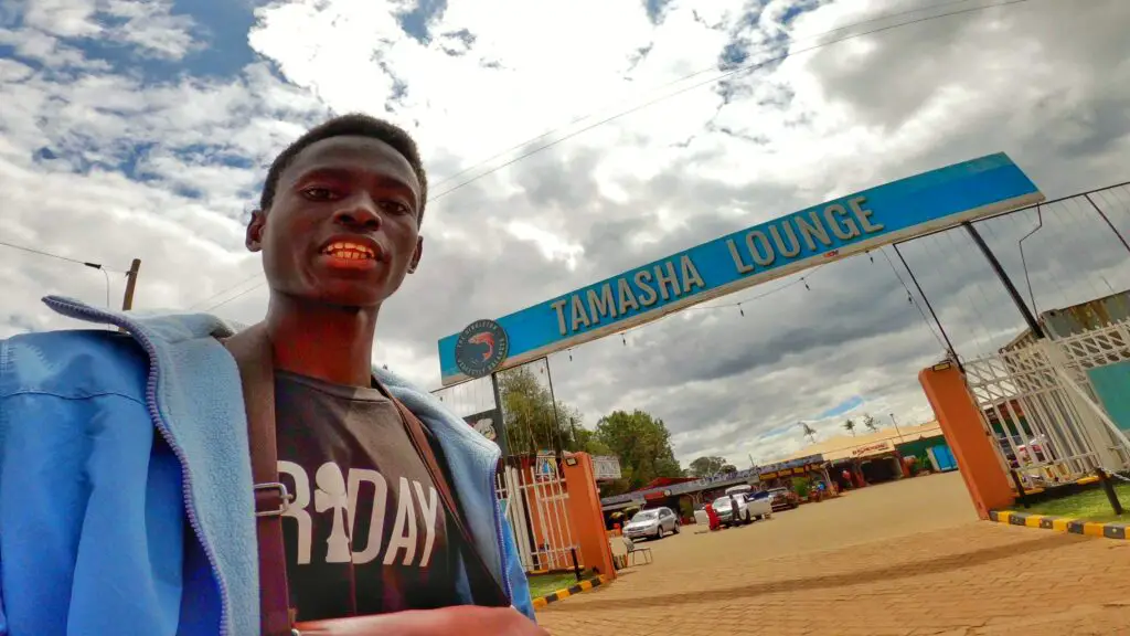 A man taking a selfie outside of Tamasha Lounge in Eldoret UASIN Gishu