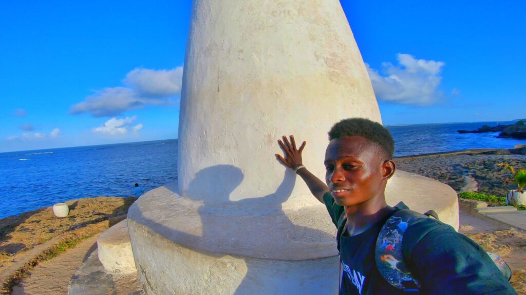 Touching the vasco da gama Pillar in malindi