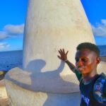 Touching the Vasco Da Gama Pillar in malindi