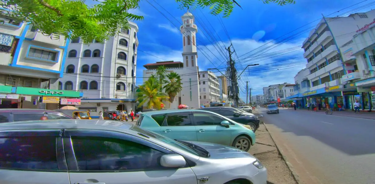 The streets of Mombasa town along Digo road, a view of a car and a mosque