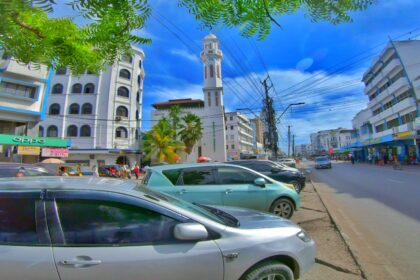 The streets of Mombasa town along Digo road, a view of a car and a mosque