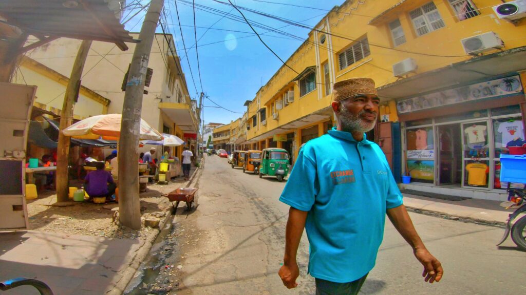 A swahili man walking majestically in Mombasa old town