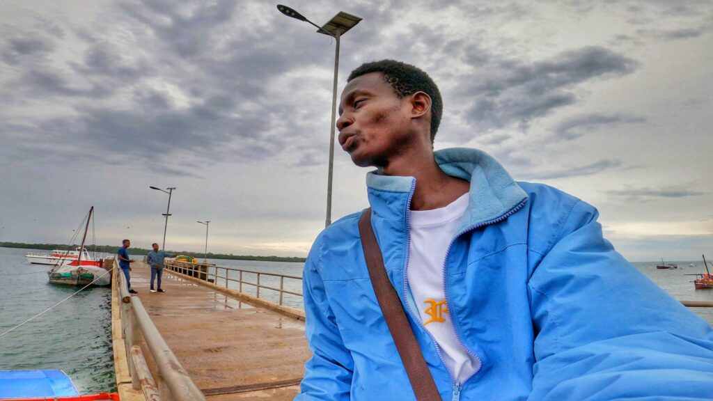 Standing at a bridge watching the ocean 