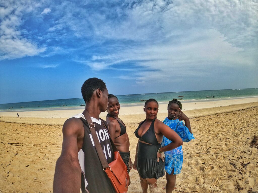 taking selfie at the beach with girls