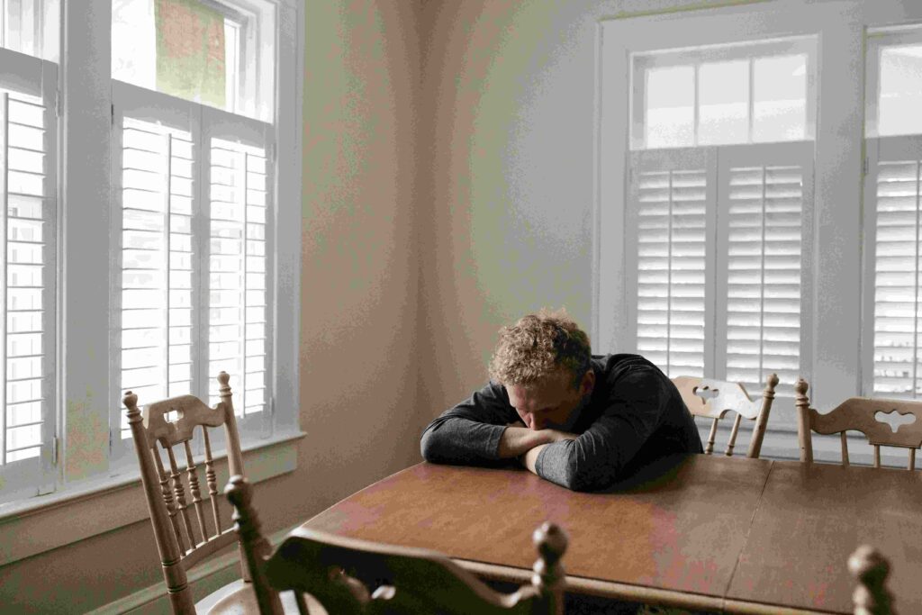 A man sitting alone stressed