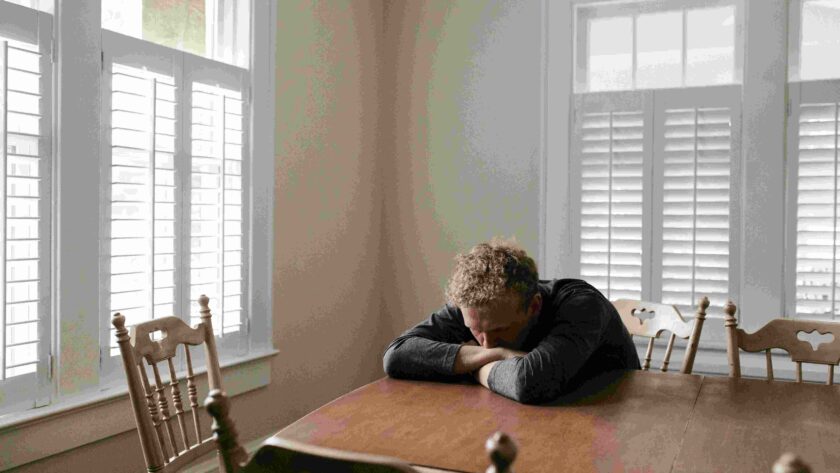 A man sitting alone stressed