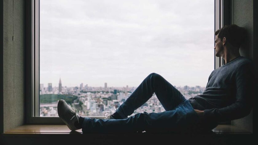 A man sitting on the window