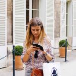 A woman texting while walking