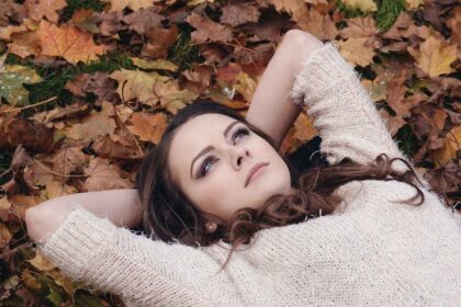 A woman laying on the ground looking up