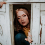 a woman hiding a closet